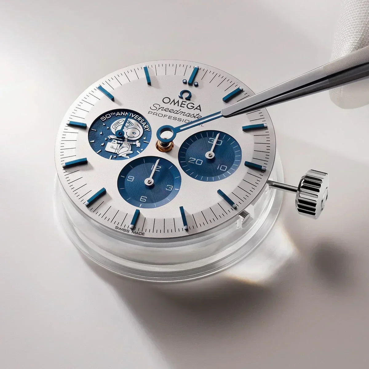 Silver and blue mechanical watch face